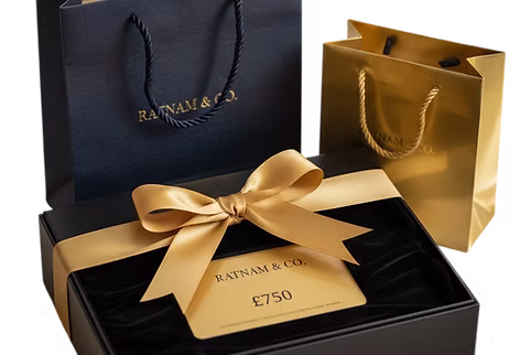 A Harrods gift card presented in a black gift box